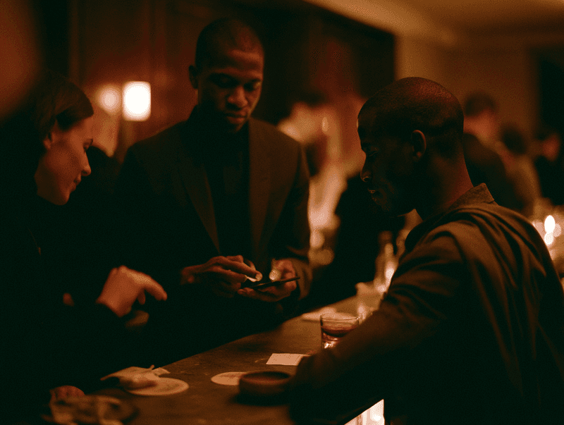 Staff coordinating service at a candlelit table