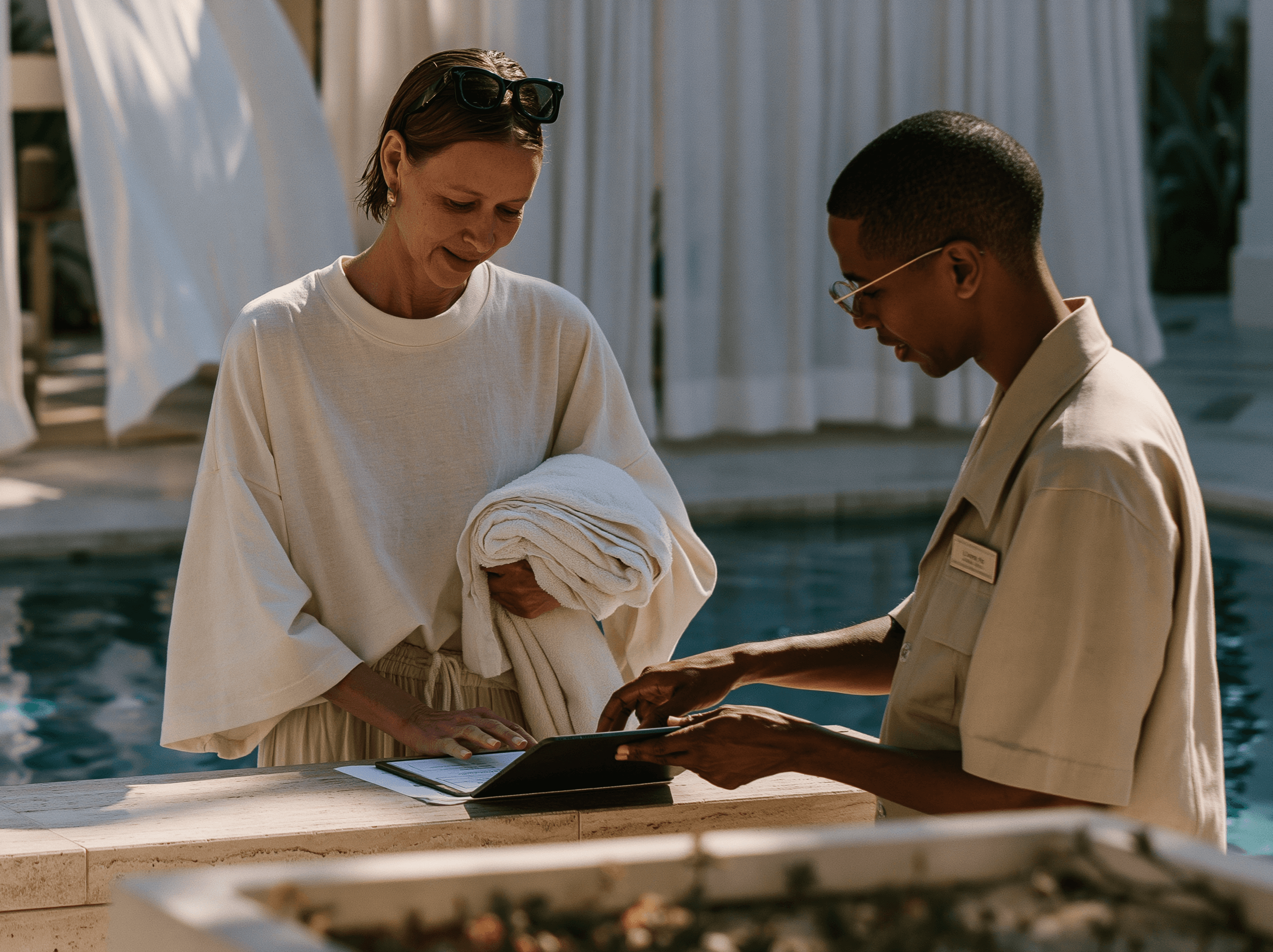 Staff assisting a returning member poolside