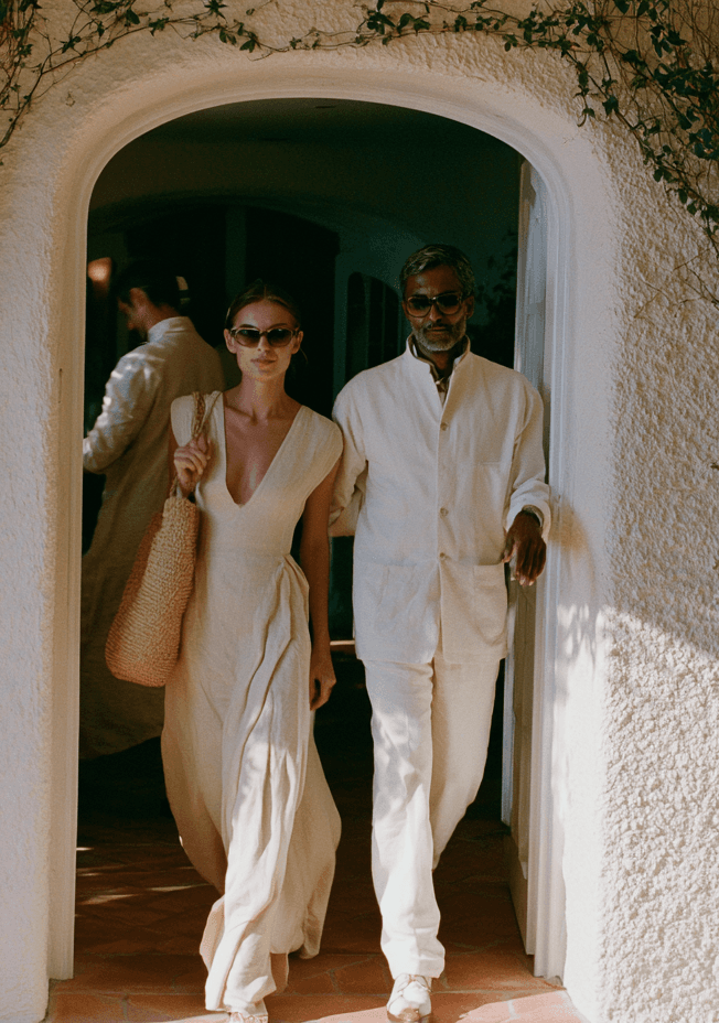 Members crossing a sunlit private club lobby