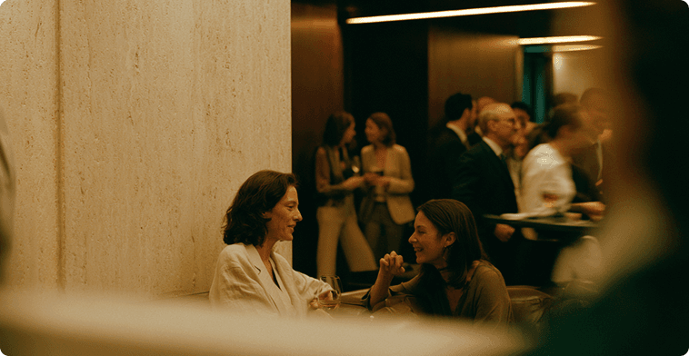 A member relaxing with a glass of wine at the club