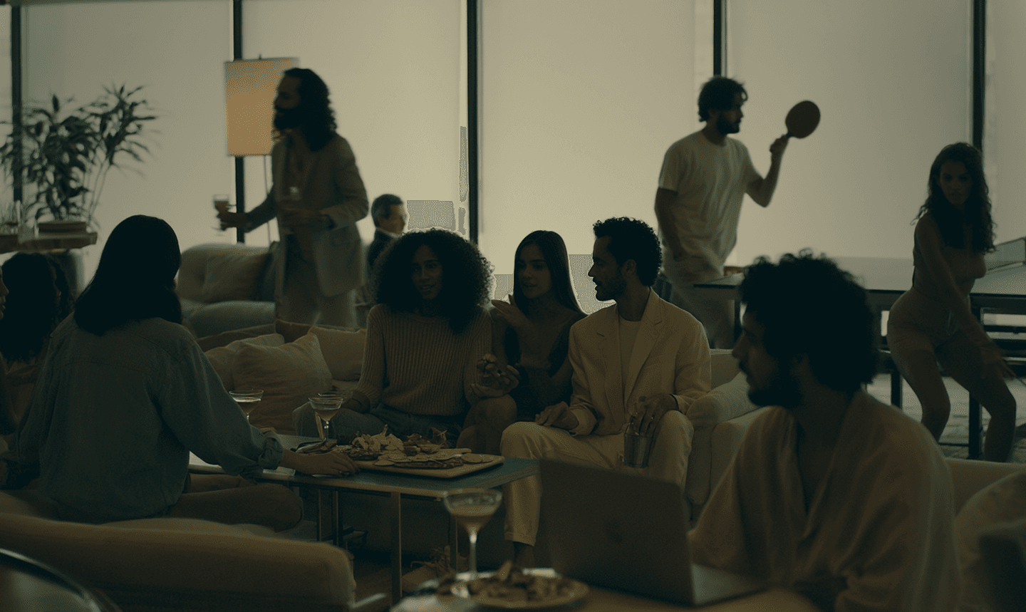 A member relaxing in a softly lit club suite
