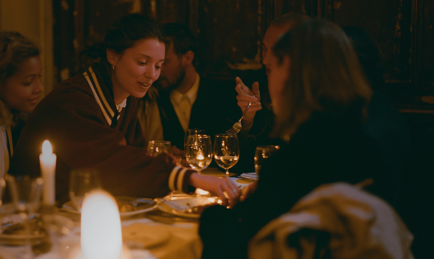 A member relaxing in a softly lit club suite